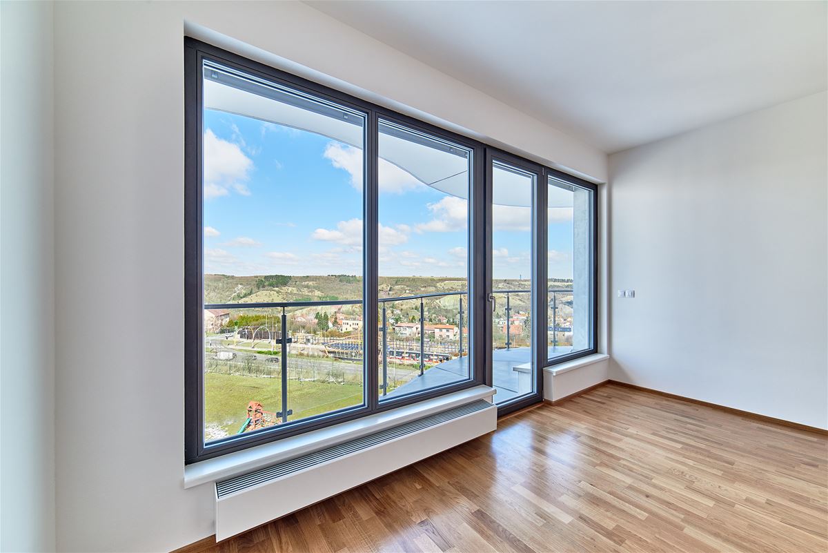 wall-mounted convector from the Czech company Minib installed under a window